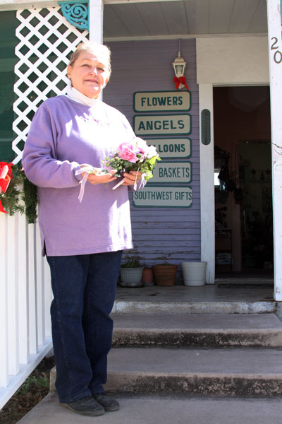 Bonnie Darlington, owner of Frontier Floral and Finery at 20 N. 4th St., says Fremont Street does split Tombstone. (Photo by Kevin Zimmerman/ASNS)