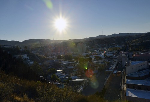 The sun sets over the International Border in Nogales, Ariz.  An average of 40,000 people cross the border into Nogales, Ariz. everyday, and in Arizona people from Mexico spend approximately $7.3 million each day statewide, according to the Arizona-Mexico Commission. 