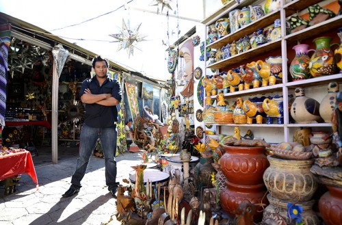 Israel Cadena Caballero is the co-owner of Broquelito Curio in Nogales, Sonora.   The shop specializes in crafts, and has been open nearly a year. Ninety percent of the shops' business comes from American, Caballero said. 