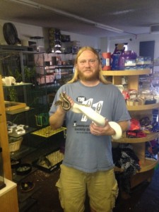 Ken MacNeil plays with a Boa Constrictor at Tucsons Exotic Pet Shop. He has been handling animals since he was a small boy.