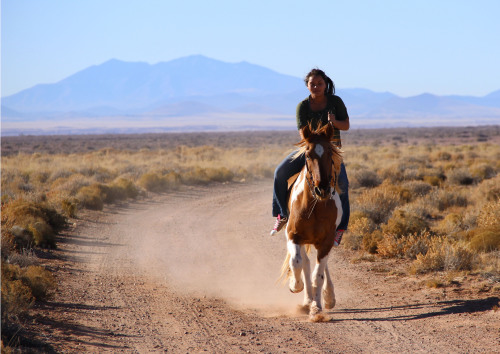 Gyill Holyan, 16, rides a horse while visiting family in Bird Springs, Ariz. The San Francisco Peaks near Flagstaff, Ariz. serve as one of the four sacred mountains of the Navajo. (Photograph by Mark Armao)