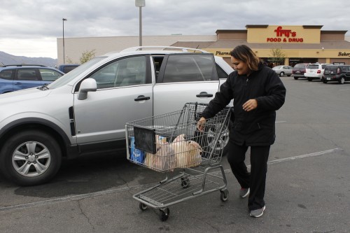 Charlene Lawrence, Tucsonan, loads grocery bags into the trunk of her car on Monday Jan. 26. Lawrence said she usually brings reusable bags when shopping or will recycle the plastic ones at the grocery store later. Photo by Nicole Thill/Arizona Sonora News Service.
