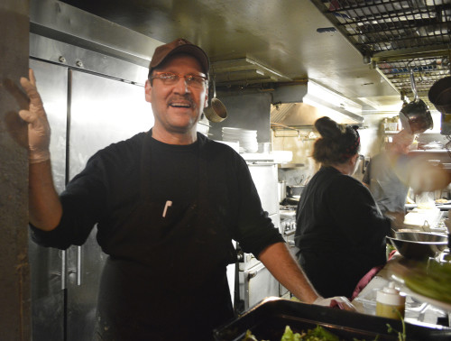 Chef Rod Kass who is the owner of Cafe Roka manages the kitchen on a busy Saturday night. (Photo by: Stephanie Romero/ Arizona Sonora News) 