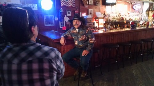 Mike inside his business Doc Hollidays Saloon being interviewed about his opinions on improving tourism in Tombstone by Echo Entertainment producer Gary Marks. Photo by Terri Jo Neff