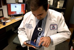Bijan Najafi, associate professor of surgery and engineering, demonstrates how they use the BioHarness and Zephyr MD app at Banner- University Medical Center Tucson on Monday, Feb. 2, 2015. Zephyr can be downloaded through the Google Play store and is not available for download on Apple iTunes Store. Photo by: Rebecca Marie Sasnett / Arizona Sonora News Service
