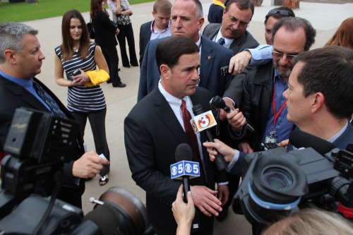 Gov. Doug Ducey speaks to the press outside the Capitol. Photo by Ethan McSweeney