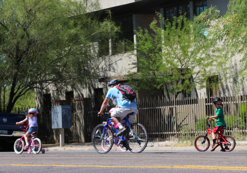A Tucson resident bikes with his kids near Santa Rita Park. Photo by: Ryan Foley/Arizona Sonora News