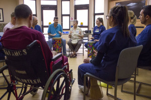 Veterans and nursing interns play drums during Jane Click's, music therapist, music therapy session at Southern Arizona VA Health Care System on Tuesday, April 21, 2015. Arizona veterans are using music therapy to help better their health.  Photo taken on Tuesday, April 21, 2015.