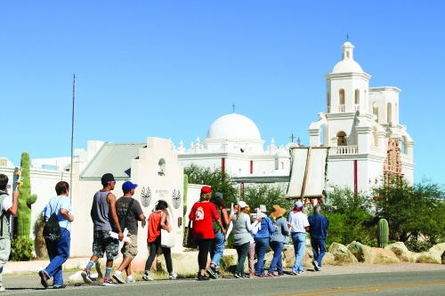 Participants gather at San Xavier Mission for a pilgrimage in honor of those lost on the border. Photo by Jennifer Hijazi