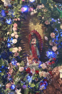 The Virgin Mary surrounded by flowers. (Photography by Valeria Flores)
