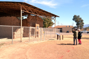 A couple takes a picture of the post hospital ruins at Fort Lowell Park. The city strives to maintain whats left of buildings like this to preserve Tucson's rich history. Photo by: Mihdi Afnan