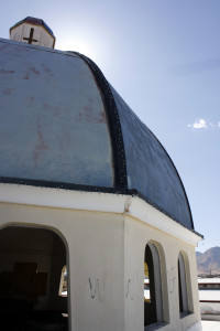 The dome at the top of the tabernacle of the Bible college, along with some graffiti, can be seen from Highway 92. (Photograph by Devon Confrey / Arizona Sonora News)