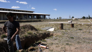 Luis Bettencourt rested a moment from his work reconstructing the old Bible college campus in Miracle Valley. (Photograph by Devon Confrey / Arizona Sonora News)