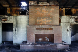 Much of the wreckage of the boy's dormitory at the Bible college has been taken out, but sits just outside the building in piles. (Photograph by Devon Confrey / Arizona Sonora News)