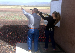 Larry Lykins and Alexa Portillo standing underneath the house in skeet. Lykins instructing Portillo on where to look and shoot. Photo by Alexa Portillo/ Arizona Sonora News Service