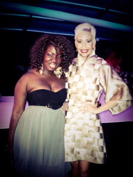 Camerone Parker, right, pictured with Project Runway season 5 designer, Korto Momolu. Parker wears the iconic seatbelt coat designed by Momolu during the "Fashion that Drives You" unconventional materials challenge. (Photo Courtesy of Camerone Parker.)