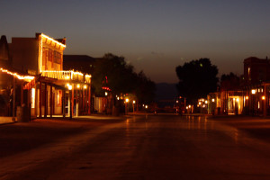 At night, Tombstone glows on Allen Street, where Nor Carrafa's bar, Doc Holliday's Saloon is located. (Photograph by Devon Confrey / Arizona Sonora News).