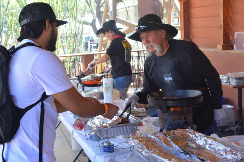 Observing what goes into preparing Rocky Mountain Oysters. Photo taken by Zach Armenta.