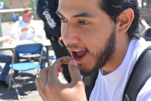 Taking a bite out of the sampler. Photo taken by Zach Armenta.