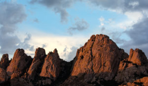 Evening light bathes the Sheepshead area in the west Cochise Stronghold near Tombstone, Ariz. on Saturday, Sept. 10, 2016. The Sheepshead itself, second from right, dominates the skyline, but is joined (from right to left) by the Crisis Center, Muttonhead, Mallethead, and Mt. Chaktar. (Alex McIntyre / Arizona Sonora News Service)