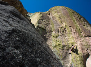 Austin Sobotka engages the thin seam that forms the majority of the first pitch of Jabberwocky (5.12c) in the Cochise Stronghold outside of Pearce, Ariz. on Sunday, Sept. 4, 2016. The second pitch takes the left-facing corner seen above the ledge marking the end of the first. (Alex McIntyre / Arizona Sonora News Service)