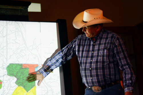Owner of ZZ Cattle Ranch Dan Bell discusses the difficulties of ranching near the border, including unprecedented fires, with UA journalism students on Monday, Sept. 26, 2016 at the Santa Lucia Ranch near Arivaca, Ariz. Bell’s ranch often falls victim to fires started by immigrants trying to detract Border Patrol from their trails.