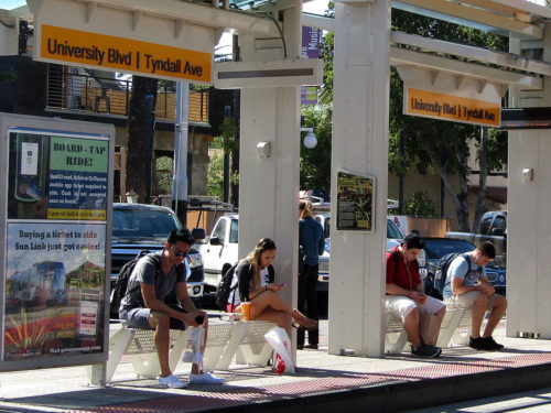 Tucsonans wait at the Sun Link streetcar stop on University Boulevard at Tyndall Avenue on Monday, Oct. 24, 2016. According Mayor Jonathan Rothschild, Tucsons five Ts, technology, transportation, trade, teaching and tourism need to be nourished in order for jobs to grow. (Photo by Gabriella Vukelic / Arizona Sonora News)