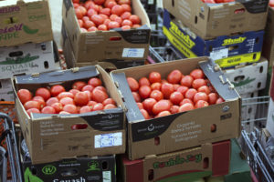 Boxes of tomatoes sit outside of the Borderlands Food Bank warehouse in Nogales, Arizona before they are loaded into a car and taken for distribution on March 7, 2016. (Photo by Tobey Schmidt / Arizona Sonora News)