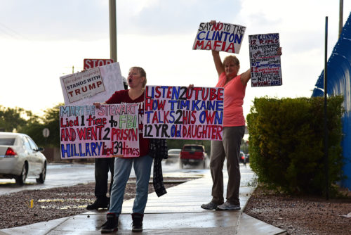 Monique Stockett, left, and Lisa Bevers, right, protest against Hillary Clinton before a speech from Democratic vice presidential candidate Tim Kaine at Sunnyside High School in Tucson, Ariz. on Thursday, Nov. 3, 2016. (Photo by Rebecca Noble / Arizona Sonora News)