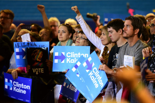 A supporter raises her fist in agreement with a point during the speech from Democratic vice presidential candidate Tim Kaine at Sunnyside High School in Tucson, Ariz. on Thursday, Nov. 3, 2016. (Photo by Rebecca Noble / Arizona Sonora News)