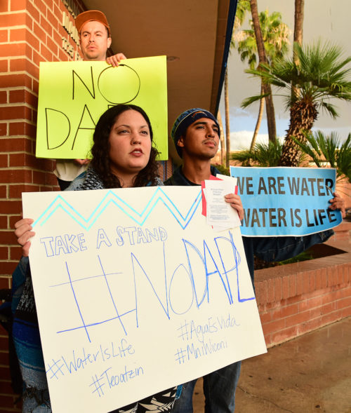 Protestors from Tucson Water Protectors stand outside the doorway to a speech from Democratic vice presidential candidate Tim Kaine at Sunnyside High School in Tucson, Ariz. on Thursday, Nov. 3, 2016. (Photo by Rebecca Noble / Arizona Sonora News)