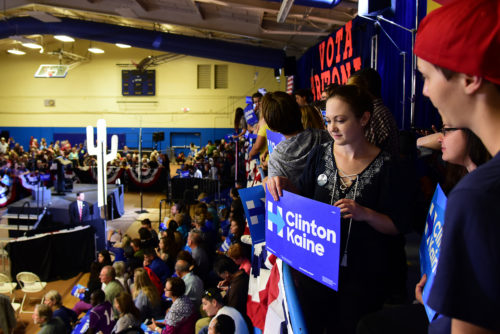 University of Arizona psychology senior Christine Zavala looks out from the balcony before a speech from Democratic vice presidential candidate Tim Kaine at Sunnyside High School in Tucson, Ariz. on Thursday, Nov. 3, 2016. Zavala supports Clinton and Kaine's stances on gay rights and economics. (Photo by Rebecca Noble / Arizona Sonora News)