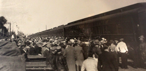 Tucsonans look on as members of John Dillinger's gang board a train at the local S.P. station after their capture in 1934. (Photo courtesy of Arizona Historical Society / Buehman Collection)