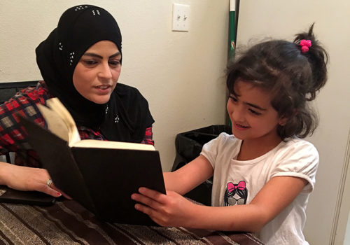Besan Adnan, 9, teaches her mother, Ibtihaj Al-Nasan, English in Tucson, Ariz. on Thursday, Oct. 13, 2016. Besan goes to public school where she learns English while also attend Sunday school to practice her religion and Arabic. (Photo by Nour Haki / Arizona Sonora News)