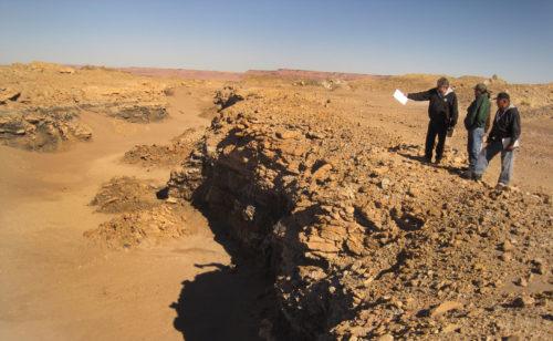 Three researcher look over an abandoned mine on the Navajo Nation on Oct. 19, 2013. Uranium mining from the mid-1900s left over 500 unregulated mines scattered once mining stopped in 1986. 

Photo by David Begay