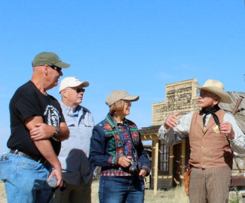 Tour guide Frank Brown chats with visitors on March 1, 2017, in Mescal, Ariz. Brown has been cast as an extra in many projects filmed at Mescal. (Photo by: Hailey Freeman/ Arizona Sonora News Service) 