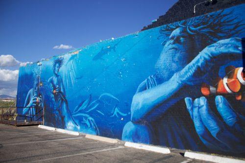 Local muralist paints Tucson brighter