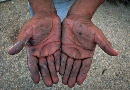 Juans hands show signs of wear from the many jobs he has worked. Photo by Monica Milberg