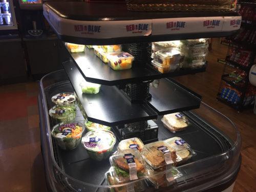 A food stand in Highland Market displays different meal options from the University of Arizona's Red & Blue Market label. For many of these products, the food labeling is incorrect.  (photo by: Erik Kolsrud/Arizona Sonora News)