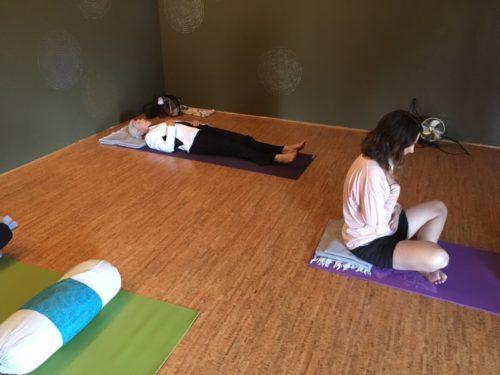 Julie Williams, instructor at Yoga Vida, has her students practice their controlled breathing before their morning yoga session. (Photo by: Jessica Carpenter / Arizona Sonora News).