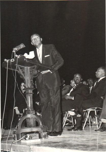 Lincoln Ragsdale gives a speech at Goodwin Stadium at Arizona State University  on June 3, 1964. Martin Luther King Jr., and Ralph Abernathy  are also pictured.