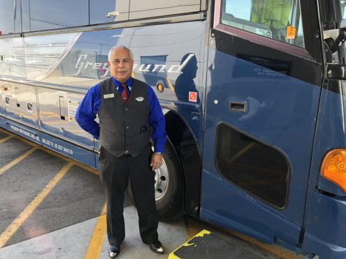 Jose Fuentes, a Greyhound bus driver, stands in front of the bus he was driving from Phoenix, Ariz. to El Paso, Texas. (Photo by: Genáe Gonzales/ Arizona Sonora News)