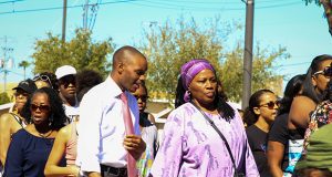 Rep. Dr. Gerae Peten and Rep. Reginald Bolding marching together at the March For Black Women In Phoenix, Ariz. on Sept. 30, 2017. (Photograph by Jenna Miller/AZ Capitol times)