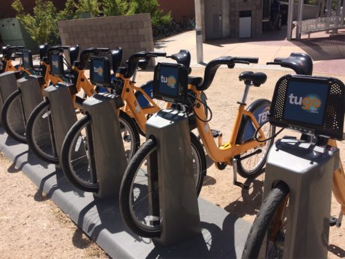 Tugo Bikes at their docking station at the Mckale Center in Tucson, Ariz. (Photo by Emily Homa)