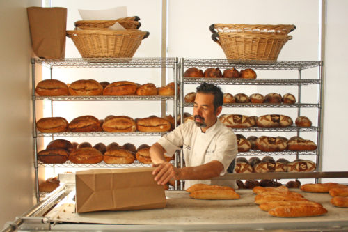 Don Guerra prepares for the opening of his bakery Barrio Bread Saturday, April 28, 2018. (Brieana Sealy / Arizona Sonora News)