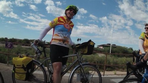 A GABA member stops for a picture before continuing her ride through the Sonoran Desert.