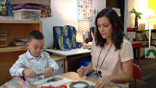 Veronica Dominguez and her son working in a classroom at Ocotillo Early Learning Center in Tucson, Ariz.
Photo by: Paige Helfinstine
