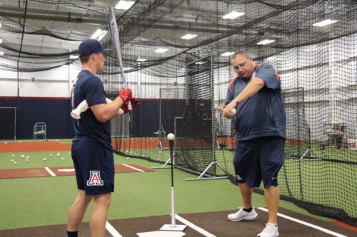 Coach Wanaka, right, demonstrates what the player should feel during this particular drill. (Photo by Justin Wylie).