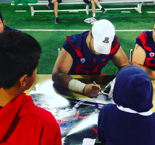 Robert Congel signs autographs.