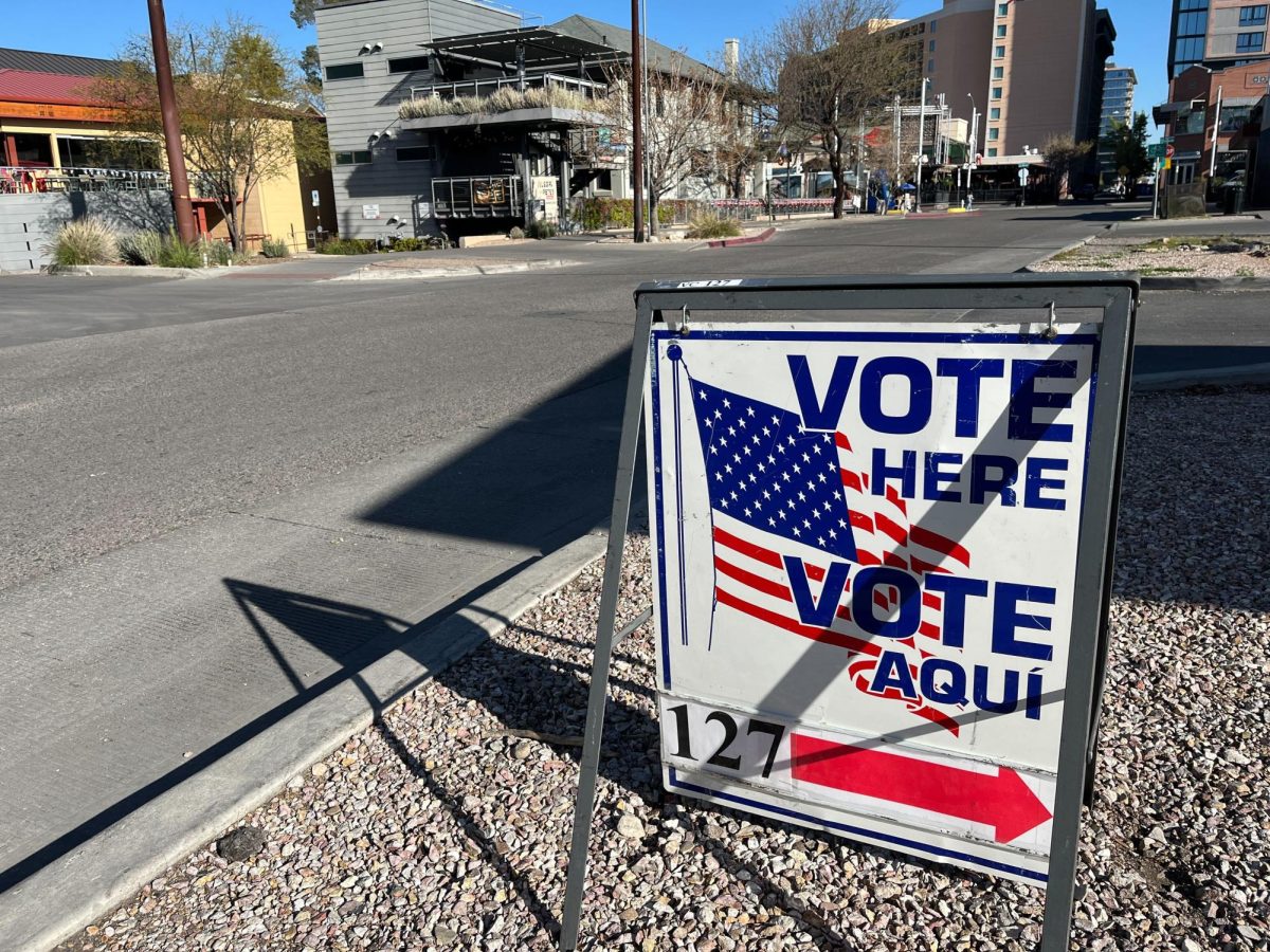 A sign points voters to First United Methodist Church on March 19. The church, adjacent to the University of Arizona campus, was open for the primary election this year. Photo by Kiara Adams